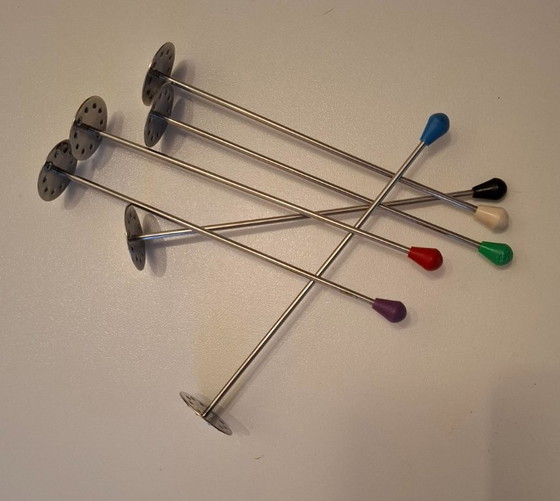 Image 1 of 1950s tonic tampers with rubber caps