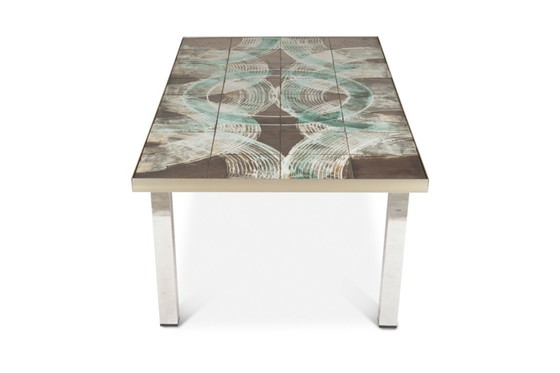Image 1 of Coffee table with ceramic and chrome-plated top. Circa 1970.