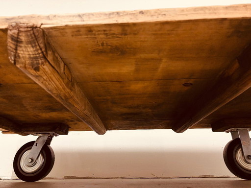 Antique, solid coffee table on castors