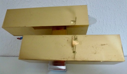 A brass wall lamp, in a minimalist, geometric style, from the middle of the last century.