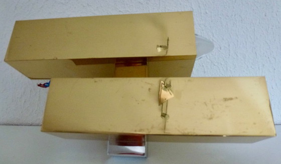 Image 1 of A brass wall lamp, in a minimalist, geometric style, from the middle of the last century.