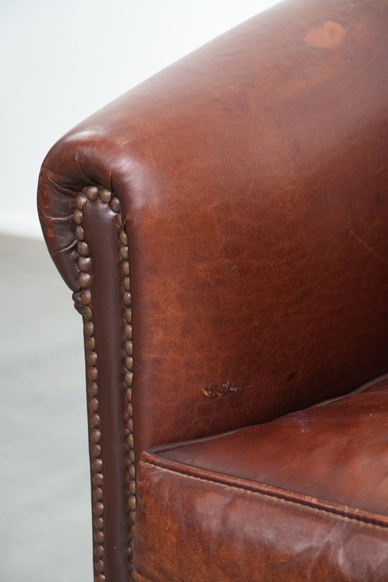 Image 1 of 2 x Vintage schapenleren clubfauteuil met siernagels 