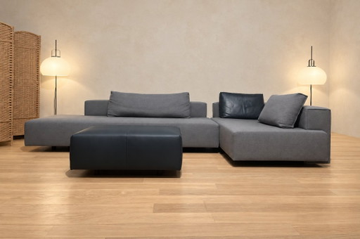 Divano angolare Eyye Cella + Pouf Ploegwol + GARANZIA
