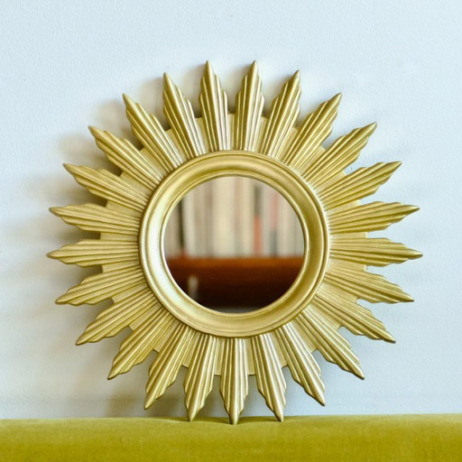Vintage gold-colored sunburst mirror
