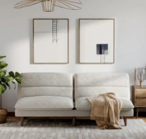 Canapé-lit futon 2 places en velours côtelé beige de luxe, convertible et capitonné.