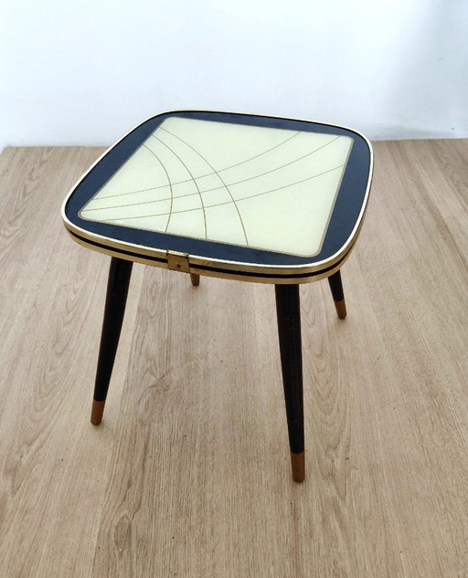 Fifties side table with unusual motif
