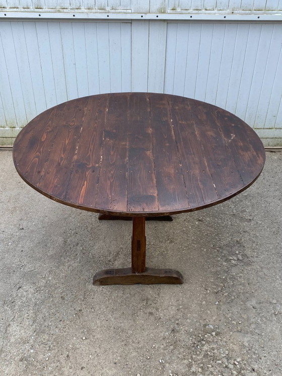 Image 1 of antique folding round winemaker's target table with tilting top
