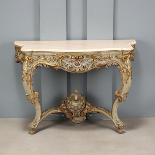 Console table in carved, gilded and lacquered wood