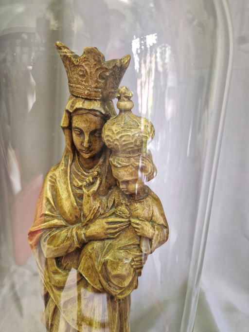 Religious statue under bell jar