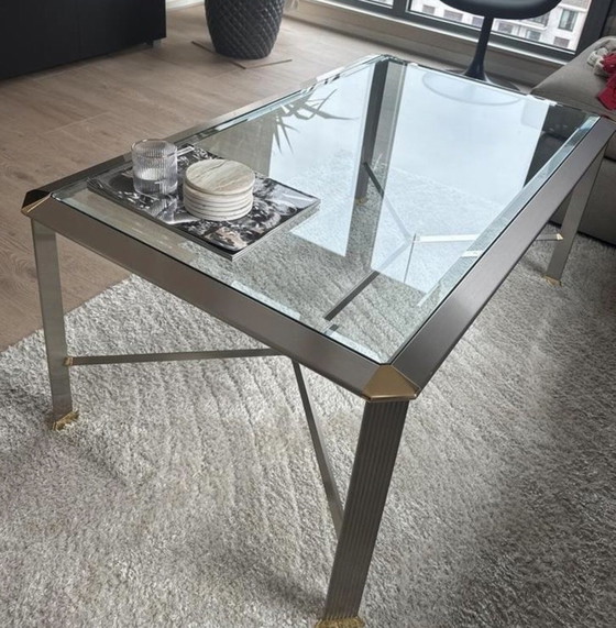 Image 1 of Dos mesas de centro de cristal plateado/dorado
