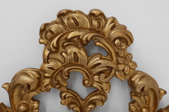 Image 1 of French Rococo or Baroque style facet-cut crest mirror in gilded carved wood