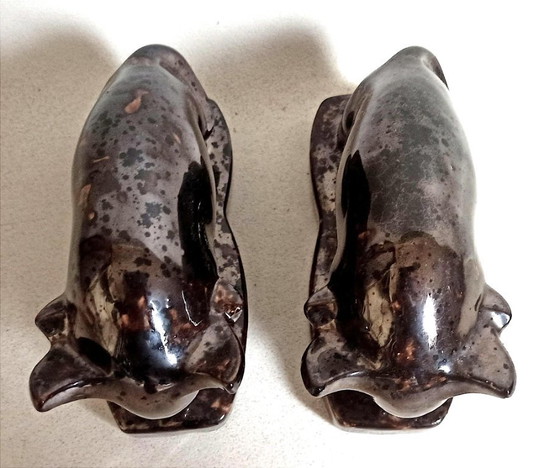 Image 1 of Een paar boekensteunen uit de jaren 60 met een gestileerd stierenontwerp.