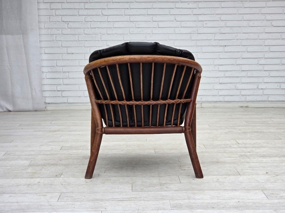 Image 1 of 1970s, Danish armchair, rattan, black artificial leather.