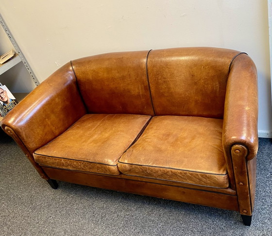 Vintage sheepskin leather sofa + armchair – Lounge Atelier, Seating area, Wood (photo 6 of 14)