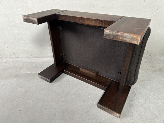 Image 1 of Vintage Leolux bruinkleurige lederen/eiken ‘Lounge chair and ottoman’ van Harry de Groot - 1970