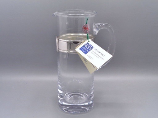 Karaf van geblazen glas met een band van 925 zilver.
