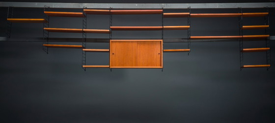 Image 1 of Modulaire wandplank in teak van Nils Strinning voor String, 1960, set van 29