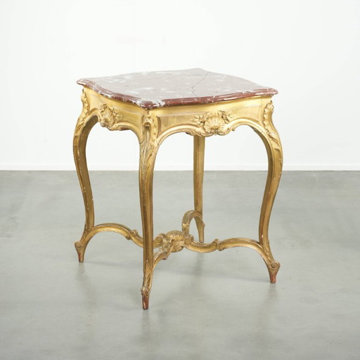 Antique French side table/center table from the 19th century with a gold-colored wooden frame and an original marble tabletop.