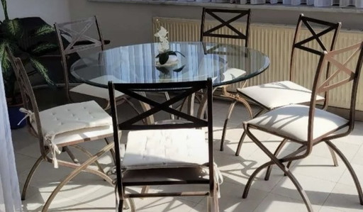 Pierre Vandel Paris Salles à manger complètes vintage, comprenant une table en verre et six chaises assorties.