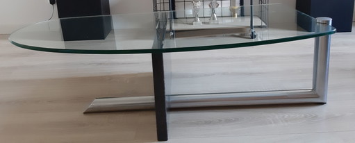 Tavolino da caffè in vetro con supporto in granito