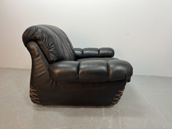 Image 1 of Beautiful Big Black Leather Postmodern Italian Design Space Age Lounge Chair with Brass Buttons and Playful Cord Lacing, 1970s.