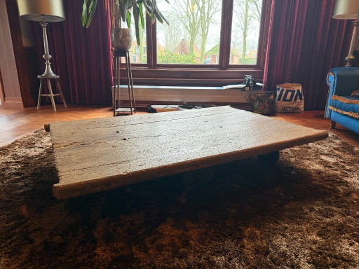 Unique industrial coffee table made of (monastery) wood on wheels