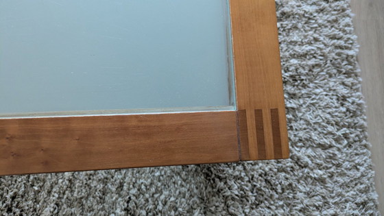 Image 1 of cherry wood red coffee table with sleek glass top from 1996