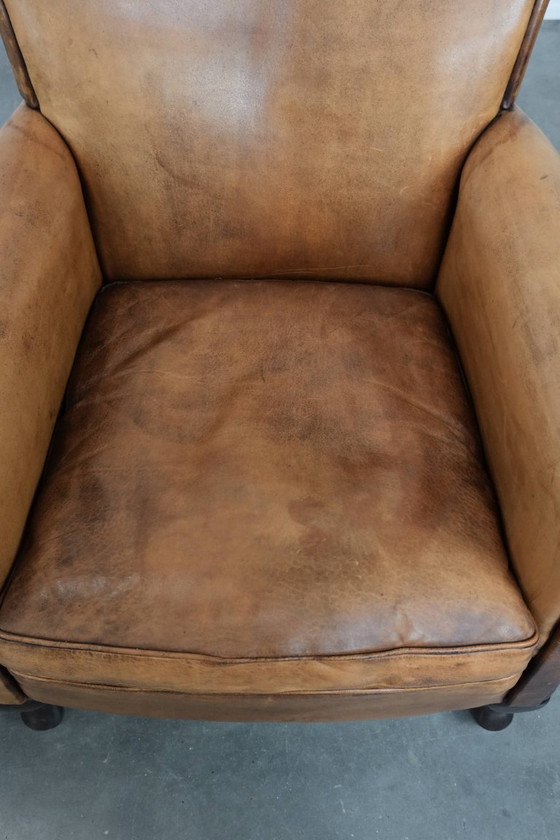 Image 1 of 2 x Subtiele vintage schapenleren fauteuil met een mooie lichte kleur