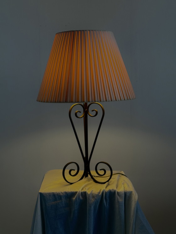 Image 1 of Vintage wrought iron table lamp in a swirl shape with a pleated shade