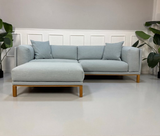 Divano Bolia Cosy Designer in tessuto blu con poggiapiedi, stile scandinavo.