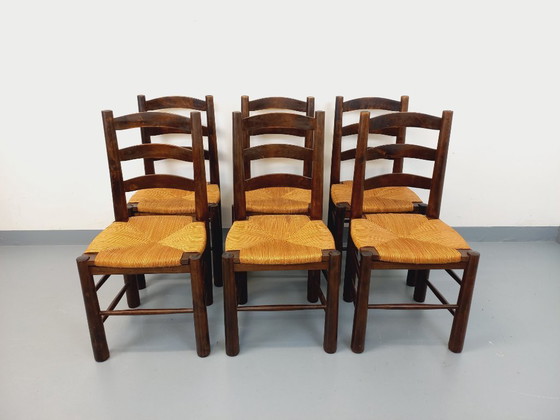 Image 1 of Set van 6 vintage brutalistische stoelen van Georges Robert, gemaakt van hout en stro, uit de jaren 50 en 60.