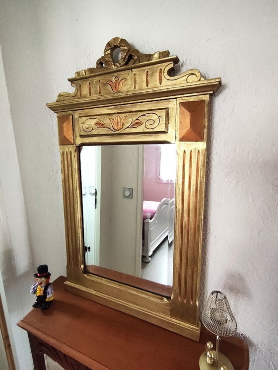 Image 1 of Gilded wooden mirror with carved pediment in the trumeau style