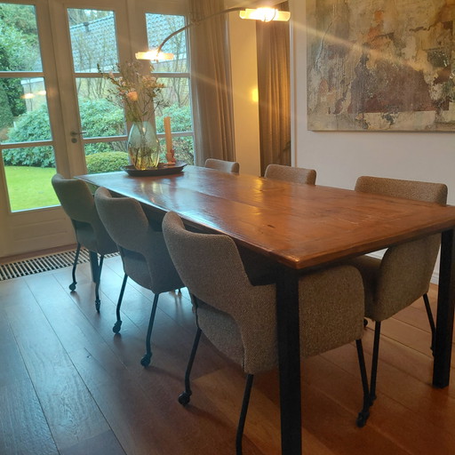 Old teak dining table with steel base