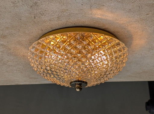 Ceiling light with a gold appearance