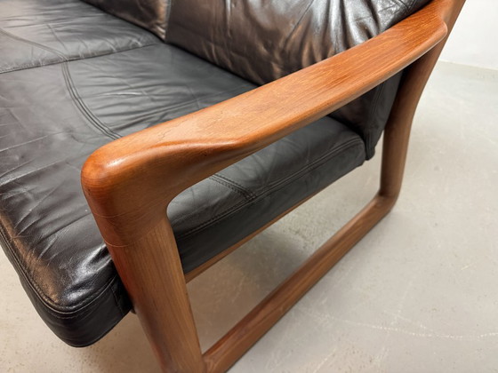 Image 1 of Mid-Century Design Komfort Solid Teak Wooden 3-Seat Sofa with Black Leather Cushions Attributed to Sven Ellekaer by Komfort