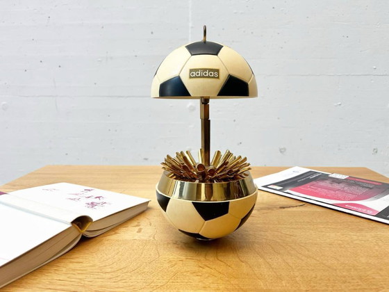 Image 1 of Vintage Adidas cigarette dispenser from the 1970s