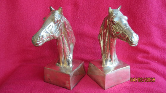 Image 1 of Sujetalibros de bronce dorado