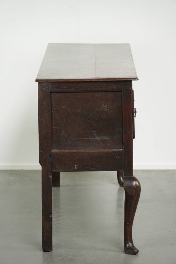 Image 1 of Beautifully sized antique 18th-century English oak dresser/sideboard with brass handles and beautiful colors.