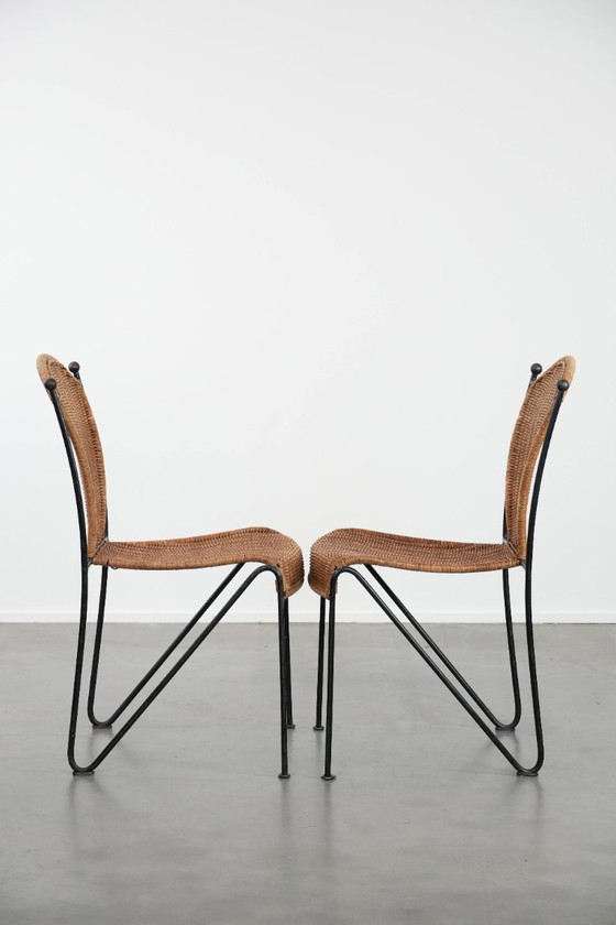 Image 1 of 2x Vintage design eetkamerstoelen van Frederick Weinberg met een gietijzeren frame
