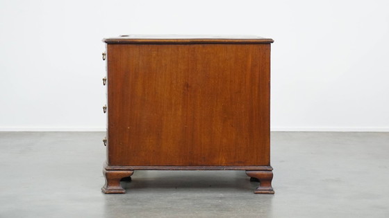 Image 1 of Luxurious and antique English wooden desk from the late 19th century with a leather top and a curved front.