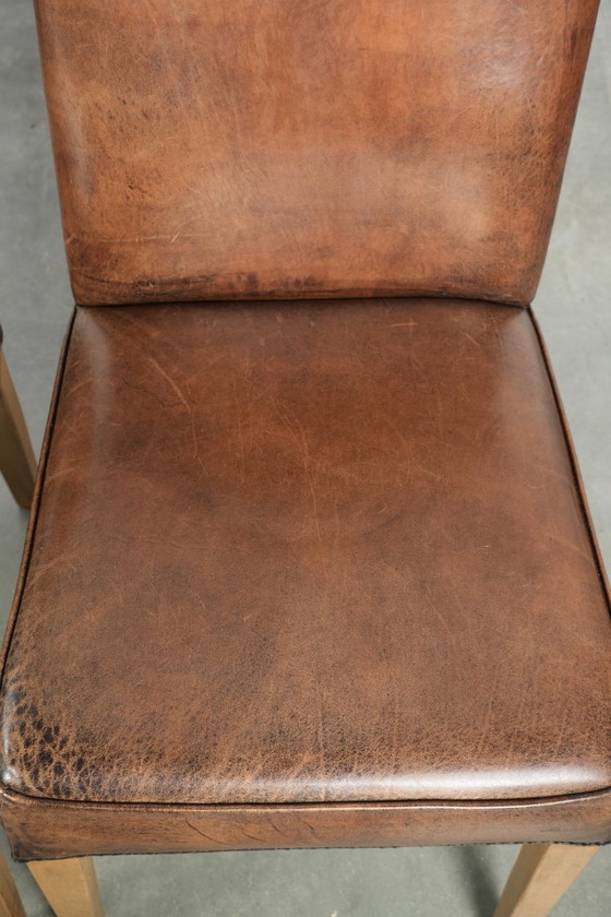 Image 1 of 4 x Vintage eetkamerstoel gemaakt van schapenleer met een hoge rug