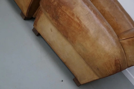 Image 1 of Ein Paar französischer cognacfarbener Ledersessel mit schnurrbartförmigen Rückenlehnen, 1940er Jahre