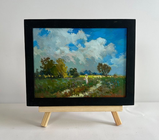 Origineel olieverfschilderij: Zomerlandschap: Een meisje loopt in een veld.