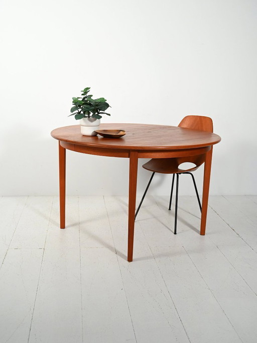 Round extendable teak table by Svante Skogh