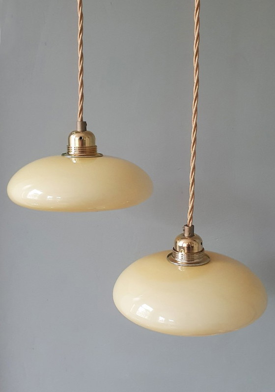 Image 1 of Vintage French pendant lamp set - of pastel yellow opaline glass.