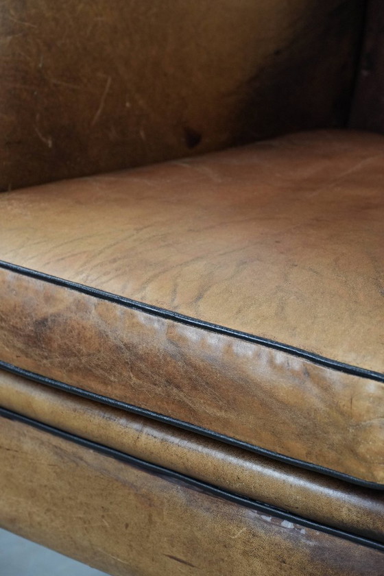 Image 1 of Sheepskin wing chair with a characterful appearance