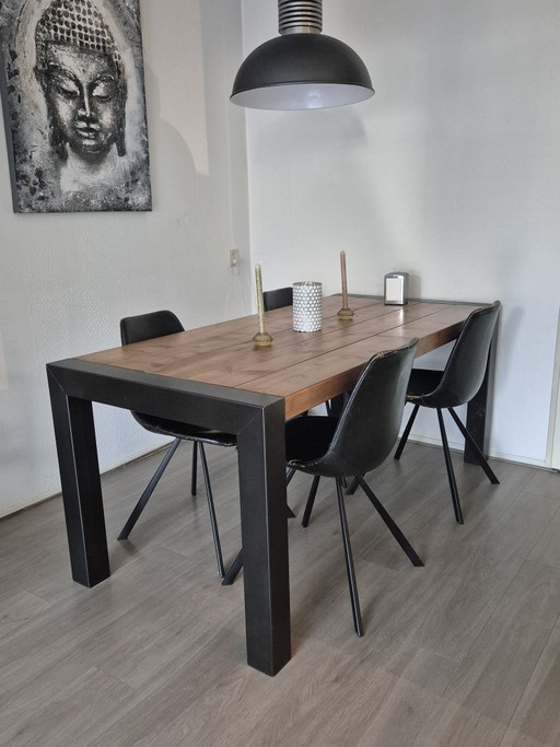 Solid wood industrial dining table.