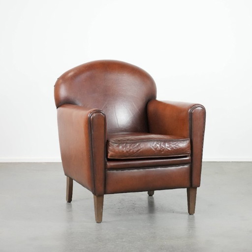 Schapenleren Art Deco design armchair met tijdloze en warme kleuren