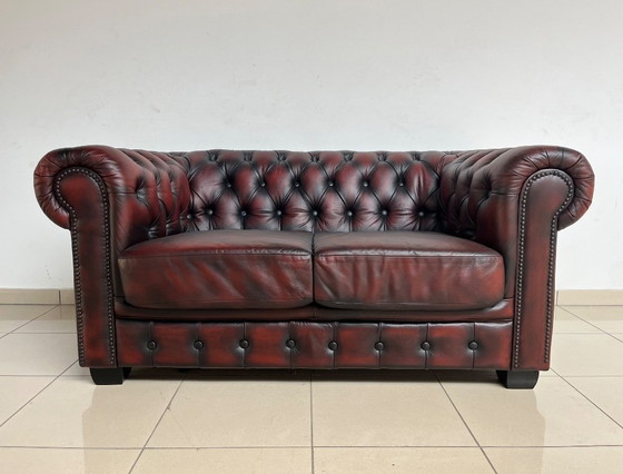 Image 1 of Chesterfield Sofa in Oxblood Leather – Fully Restored, Classic Design