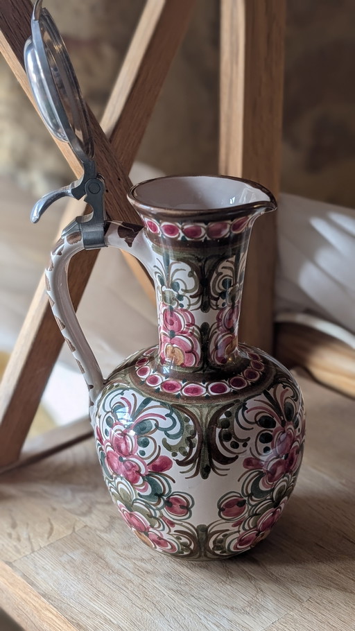 Antique hand-painted earthenware pitcher

Red and green floral decoration - signed ASM 0375